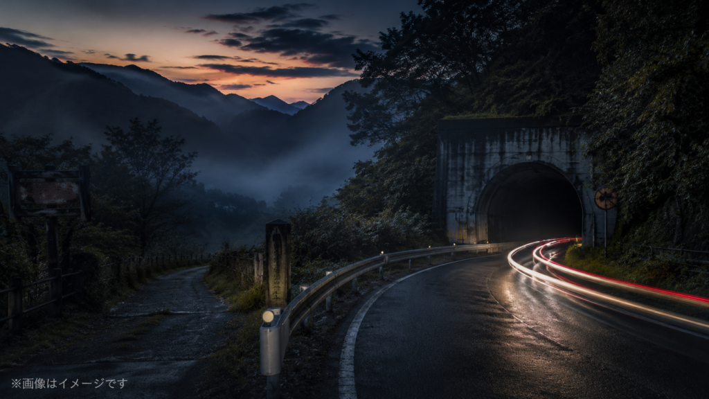 Misty mountain road at dusk